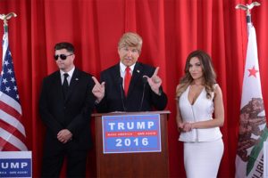 Parody of a press conference featuring Donald Trump, Sarah Palin and Melania Trump and a security guard