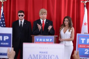 A Donald Trump impersonator is bookended by an extra playing a security guard and a porn star playing Melania Trump in this fake press conference from BaDoinkVR